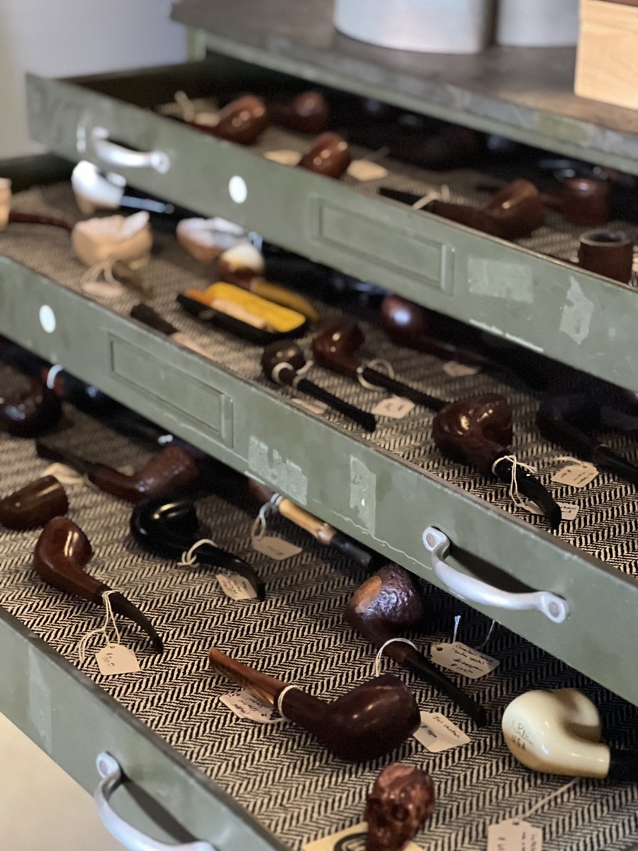 Drawers of antique and vintage estate pipes with price tags